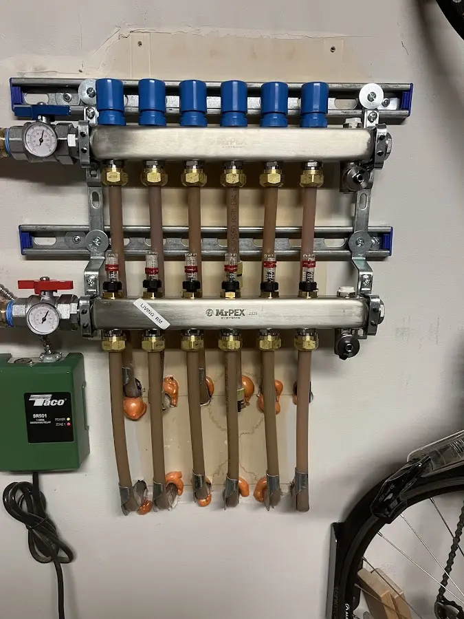 Plumber performing Water Heater Repair at a residential property in Kearns